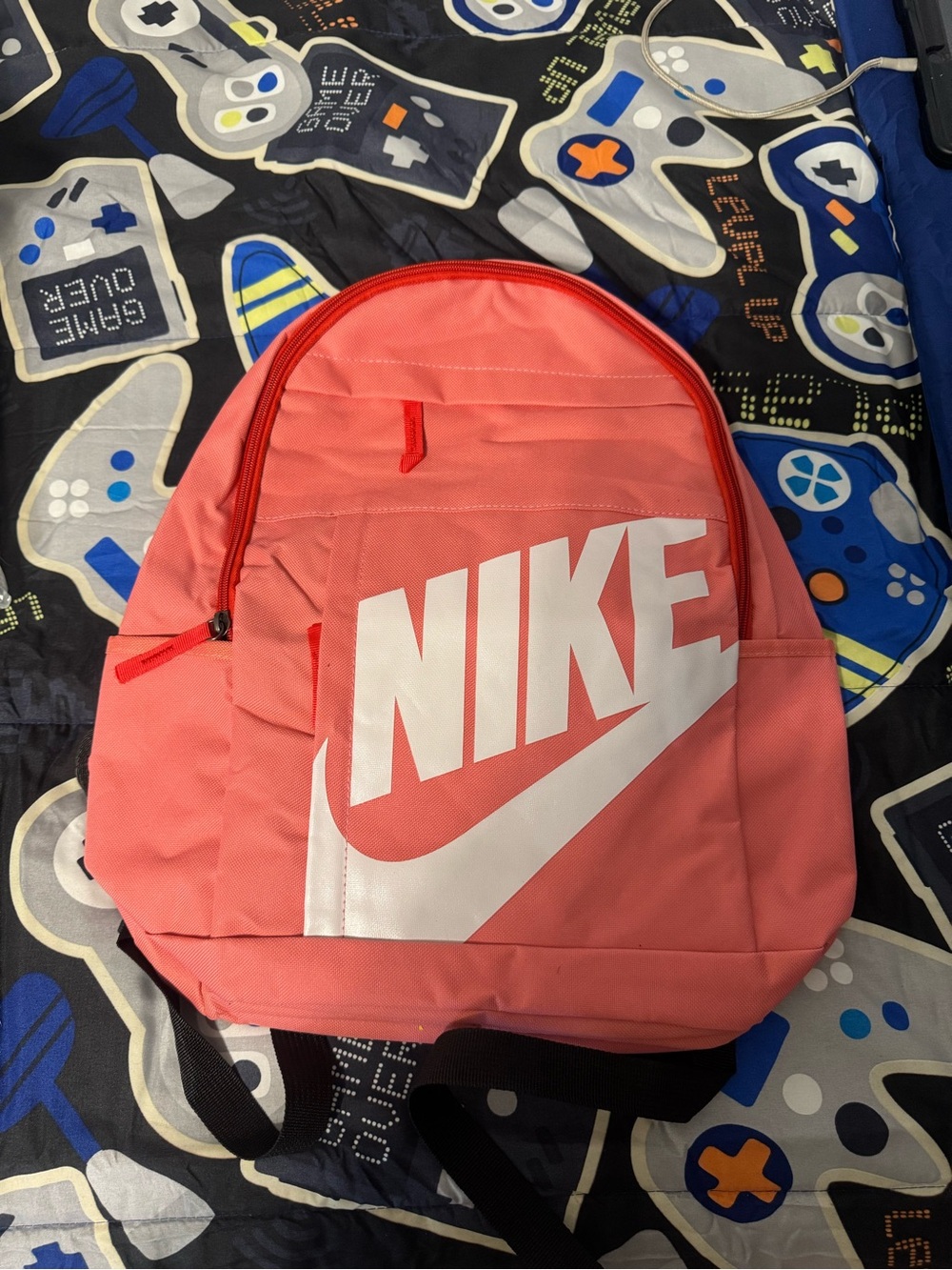 Nike Coral Pink Backpack with White Logo and Swoosh